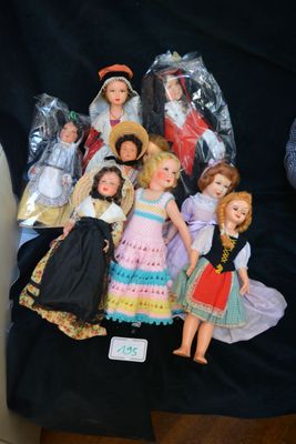 a black shirt with a bunch of dolls on it