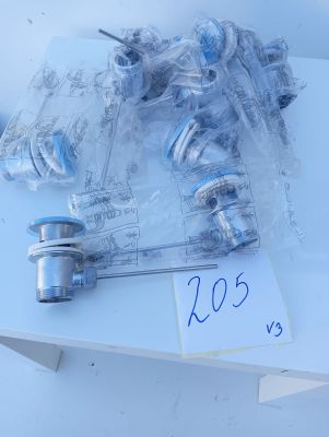 a lot of different types of valves on a table