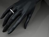 an image of a woman ' s hand with a ring on it