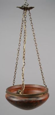 an image of a hanging bowl with a bird on it