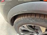 a close up of a car ' s tire on the street