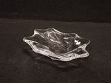 a glass bowl that is sitting on a black surface