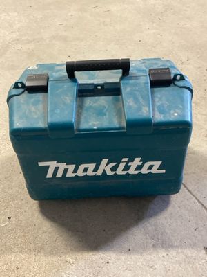 a blue tool box that is sitting on the ground