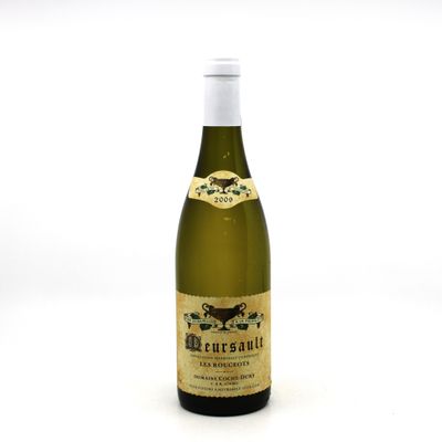 a bottle of wine that is sitting on a table