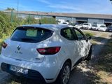 a white car parked on the side of the road
