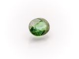 a green tourmaline gems on a white background