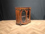 an old wooden cabinet sitting on top of a hard wood floor