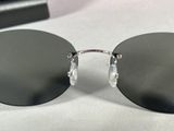 sunglasses on a white table with a black case and a pair of glasses