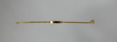 a close up of a gold bracelet with an arrow on it