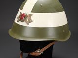 a green and white helmet with a star on the side