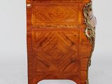an antique wooden cabinet with marble top on casteors and a marble top