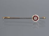 a close up of a red and white diamond tie bar