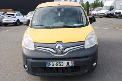 a yellow and black van parked in a parking lot