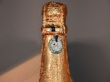 a bottle of champagne that has a clock on it