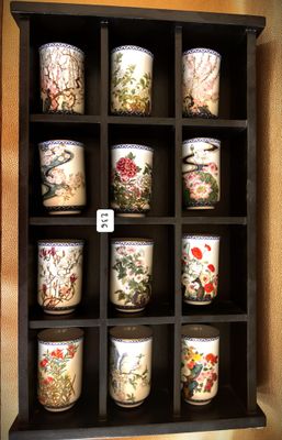 a display case with a lot of cups on it
