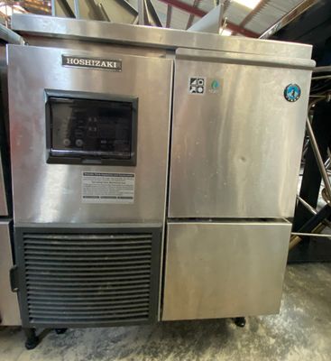 an image of a stainless steel refrigerator in a warehouse