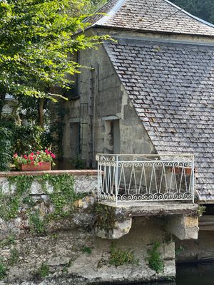 an image of a house on a bridge over a river