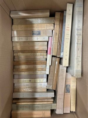 a box full of books that are sitting on the floor