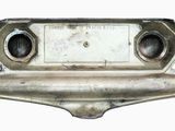 a metal object that is on a white surface