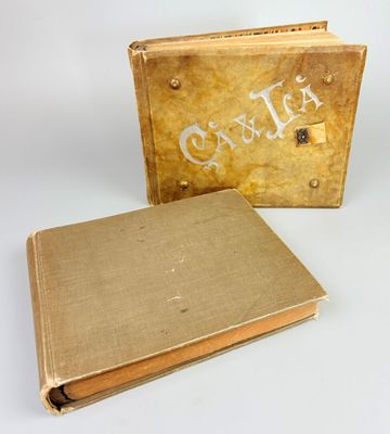 an old book sitting next to a box with the word caulia written on it