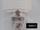 a lamp that is sitting on a table next to a lamp