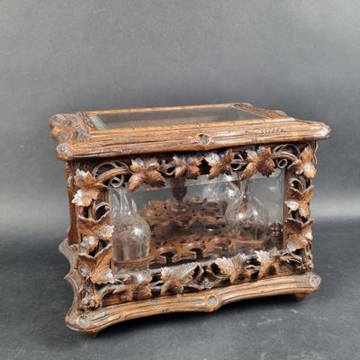 a small wooden box with a glass top on a table
