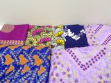 plusieurs types de draps disposés sur un lit