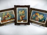 three framed pictures of flowers in a vase on a table