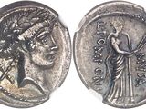 a close up of a silver coin with a woman on it