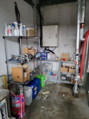a room that has a lot of items on the shelves