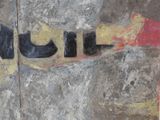 a painting of a pair of black boots on a wall