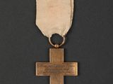 an image of a gold medal with a cross on it
