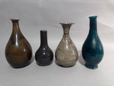 three vases sitting next to each other on a table