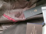 a passport and a passport sitting on top of a jacket