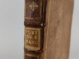 an old book sitting on top of a wooden table