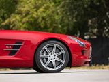 the red sports car is parked on the side of the road