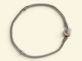 silver plated bracelet with a silver bead and a silver clasp