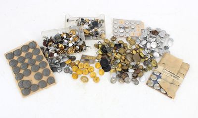 a lot of different types of buttons in a box