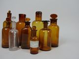 a lot of bottles that are lined up on a table