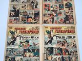 three old comic books are sitting on a table