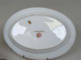 a white plate with a red dot on it
