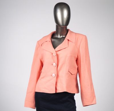 an image of a mannequin mannequin wearing a pink jacket and black skirt