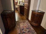 a rug on the floor in the hallway of a house