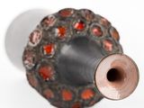 a close up of a metal object with a hole in it