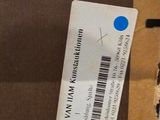 a cardboard box with a label on it that has a sticker on it