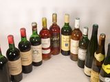 many bottles of wine that are lined up on the table