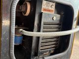 a close up of a machine that is sitting on a pallet