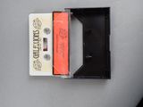 two cassettes sitting next to each other on a table