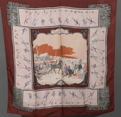 an image of a red scarf with a picture of a horse drawn carriage
