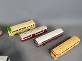 many different types of toy trains sitting on a table